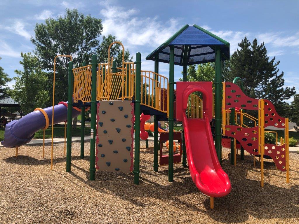 Side view of Hart Park showing climbing wall and single slide