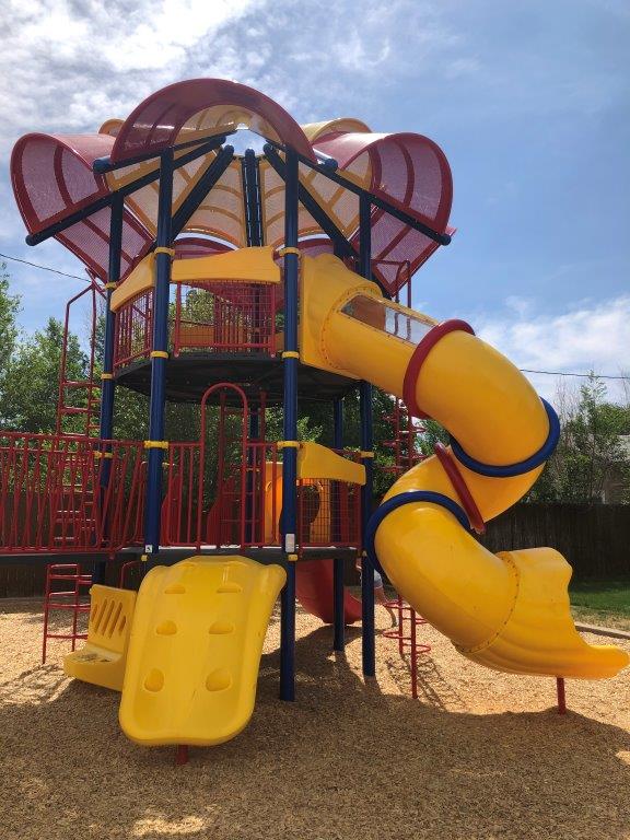 Vertical view of tall yellow spiral slide