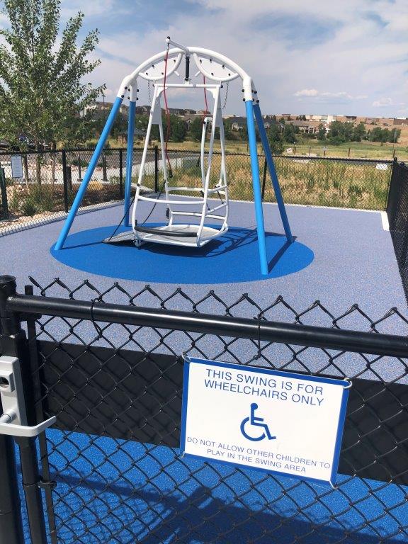 Wheelchair swing at inclusive playground in Aurora Colorado