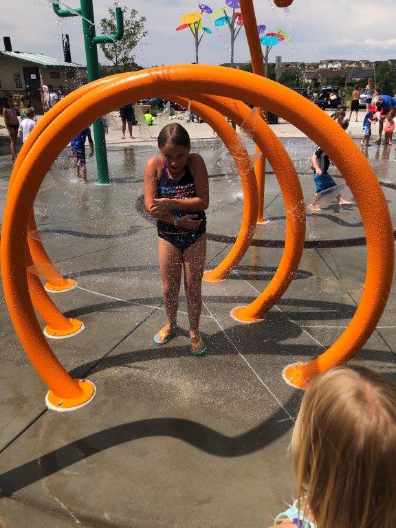 Girl shivering in splash park