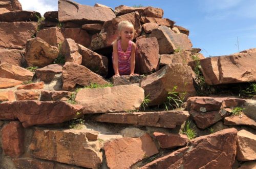 Arapahoe Ridge Park in Boulder Colorado girl climbing through rock caves