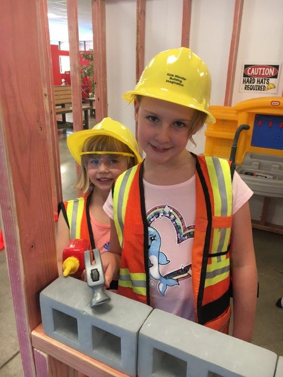 Centennial Kids Wonder indoor play area in Colorado two girls with construction hats