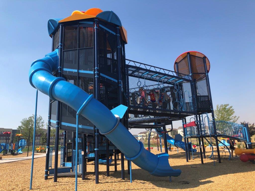Side view of large play structure at Deputy Parrish Park in Castle Rock tallest slides in Colorado