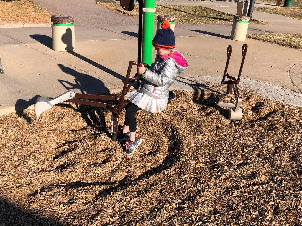 Girl playing at Cherry Park in Thornton CO