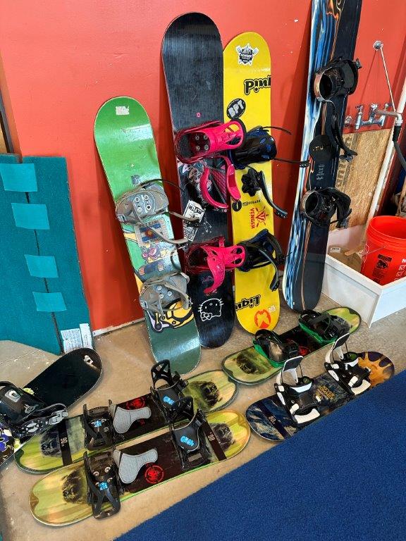 View of snowboards for use at Shredder Ski Frederick