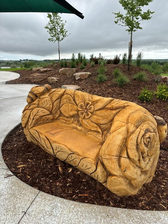 wood carving bench at Loveland Willow Bend Park
